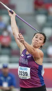 Javelin Thrower In Sleeveless Athletic Top Releasing Spear