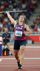 Javelin Thrower In Track Uniform And Explosive Run Up