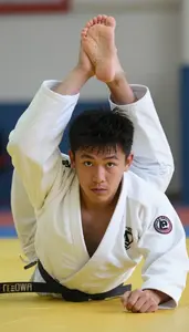 Judo Specialist Wearing White Belt Determined Sweeping Foot