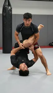 Mixed Martial Artist In Grappling Shorts And Rash Guard