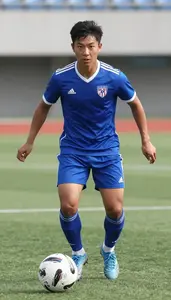 Soccer Forward Wearing Shorts Focused Defending Chip Shot In