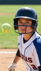 Softball Player In A Dirt Stained Uniform And Helmet Removed
