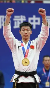 Wushu Sanda Fighter Wearing Traditional Costume Standing