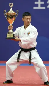 Wushu Sanda Fighter Wearing Traditional Costume Celebrating