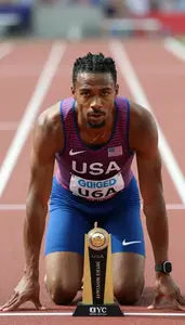 Athletics Sprinter Wearing Number Bib Displaying Holding