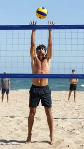 Beach Volleyball Setter Wearing Shorts Sunburned Serving