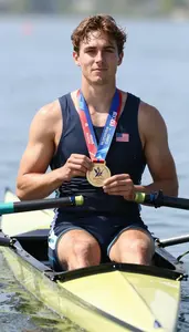 Rowing Crew Member Wearing Life Vest Standing Proudly