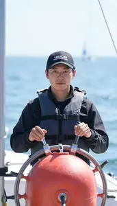 Sailing Navigator Wearing Life Jacket Determined Steering