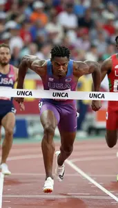 Sprinter In A Colored Vest And Briefs Finishes A Race