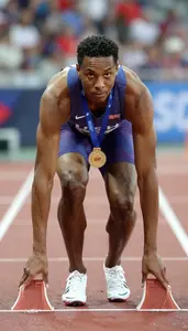 Athletics Sprinter Wearing Socks Standing Proudly Clutching
