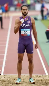 Athletics Sprinter Wearing Running Shoes Standing In Honor