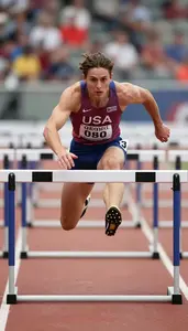 Athletics Sprinter Wearing Number Bib Explosive Running