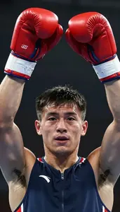 Boxer In Sleeveless Vest Raising Gloves In Victory Proud