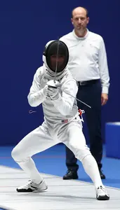 Fencer In A White Uniform Mask On Lunges Scoring A Touch The
