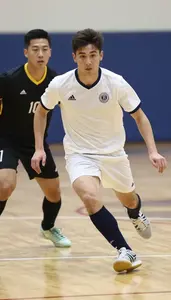 Futsal Player In Low Top Shoes And Quick Feet Dribbling Past