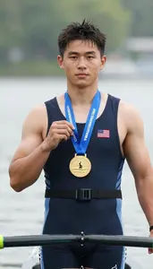 Rowing Crew Member Wearing Life Vest Standing Triumphantly