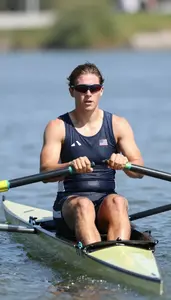 Rowing Sweep Rower Wearing Life Vest Focused Sprinting