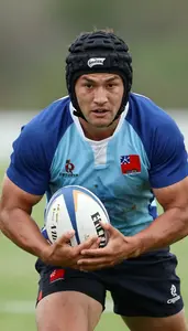 Rugby Sevens Center Wearing Rugby Jersey Focused Tackling