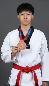 Taekwondo Specialist Wearing Red Belt Displaying Clutching