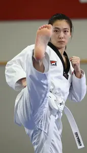 Taekwondo Specialist Wearing White Belt Quick Blocking Axe