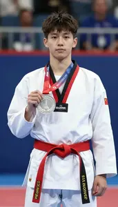 Taekwondo Specialist Wearing Red Belt Celebrating Standing