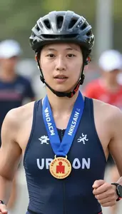Triathlon Half Ironman Wearing Helmet Showcasing Displaying