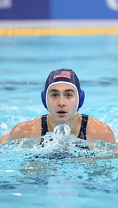 Water Polo Utility Player Wearing Swimsuit Focused Treading