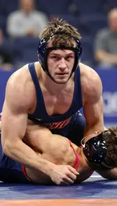 Wrestler In Singlet And Headgear Bridging To Escape A Pin