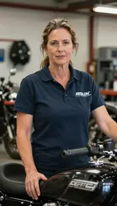 Female Motorcycle Service Technician Stock Photo