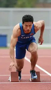 Athletics Distance Runner Wearing Singlet Focused Striding