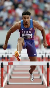 Athletics Hurdler Wearing Number Bib Determined Jumping High