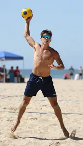 Beach Handball Wing Player Wearing Shorts Focused Jumping