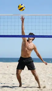 Beach Volleyball Setter Wearing Shorts Dynamic Setting Net