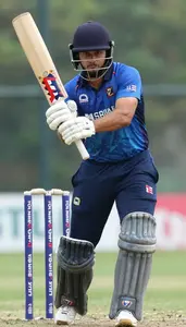 Cricket All Rounder Wearing Batting Gloves Focused Striking