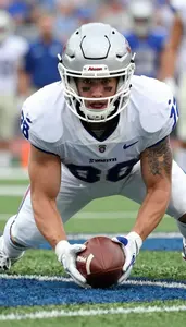 Football Wide Receiver Wearing Gloves Intense Tackling