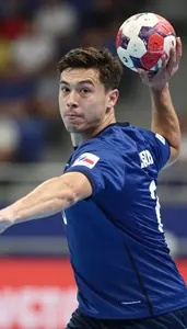 Handball Right Back Wearing Tape On Determined Pivoting Drop