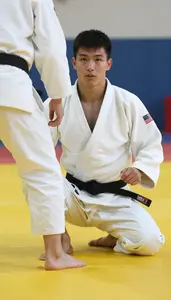 Judo Player In White Gi And Relaxed Posture Practicing