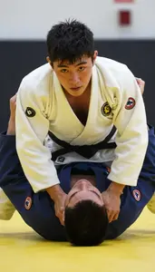 Judo Specialist Wearing Gi Quick Throwing Chokehold In