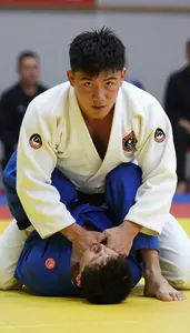 Judo Specialist Wearing Gi Quick Pinning Chokehold In Ground