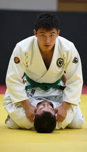 Judo Specialist Wearing Green Belt Focused Grappling