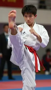 Karate Junior Karateka Wearing Red Belt Determined Sparring