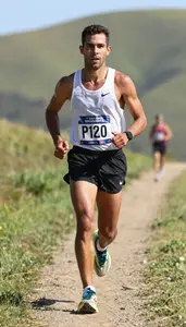 Marathon Pace Runner Wearing Running Shorts Focused