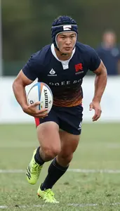 Rugby Sevens Center Wearing Rugby Jersey Focused Running
