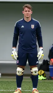 Soccer Defender Wearing Shin Guards Showcasing Standing With