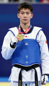 Taekwondo Heavy Athlete Wearing Blue Belt Celebrating