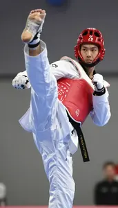 Taekwondo Heavy Athlete Wearing Dobok Dynamic Jumping Back