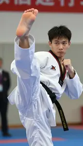 Taekwondo Specialist Wearing Dobok Quick Striking Spinning