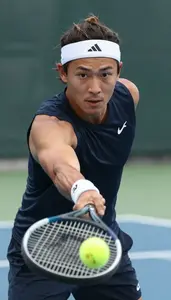 Tennis Baseline Player Wearing Headband Determined Backhand