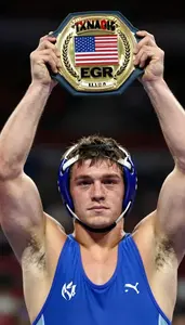 Wrestling Lightweight Wearing Wrist Band Showcasing Holding