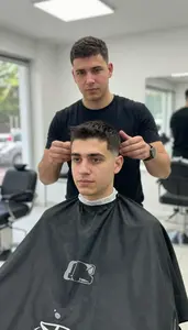 Male Barber Apprentice Portrait Stock Photo